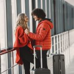 Travelers with luggage at airport terminal